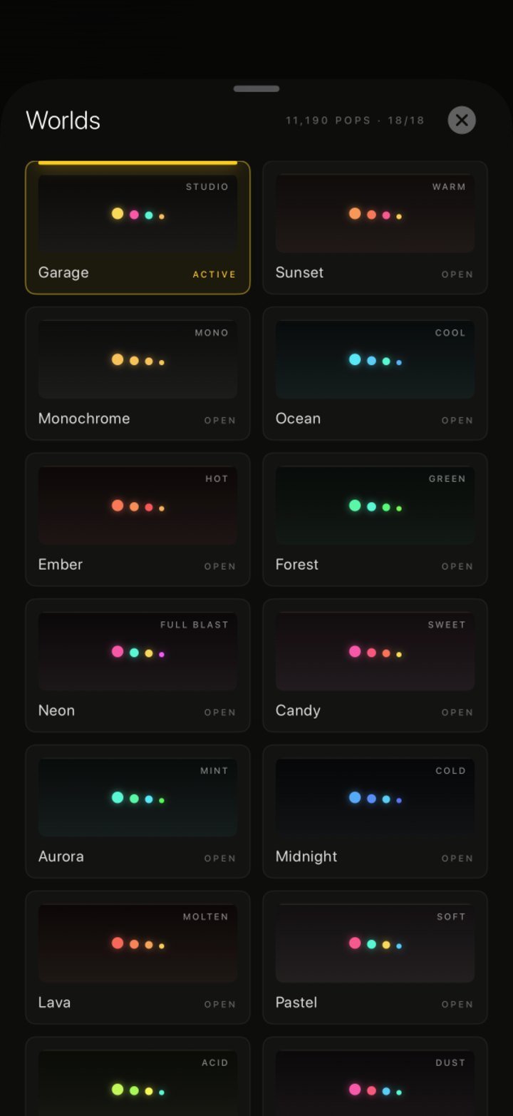 The Worlds sheet in Bubble Drift, showing Garage active plus Sunset, Monochrome, Ocean, Ember, Forest, Neon, Candy, Aurora, Midnight, Lava and Pastel, with 11,190 pops and 18 of 18 unlocked.